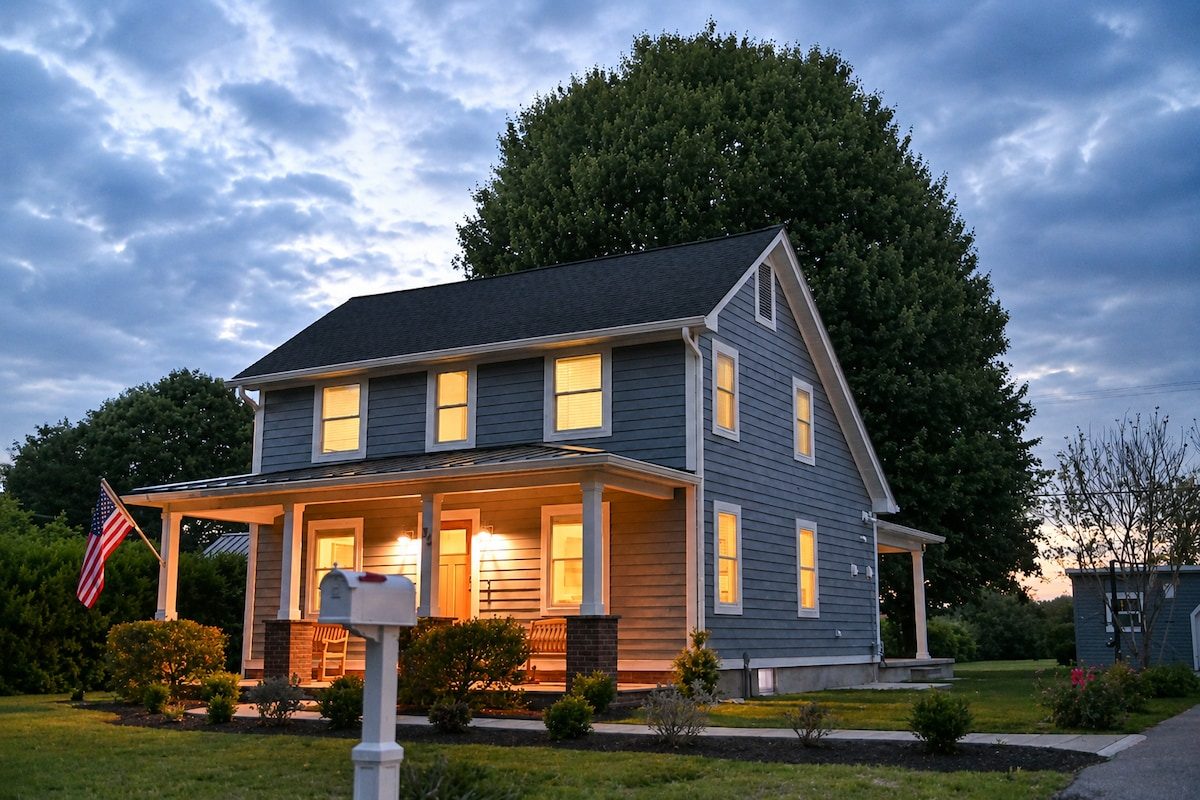 Screened porch glowing at dusk